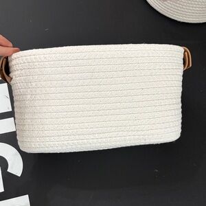 Woven basket with leather handles